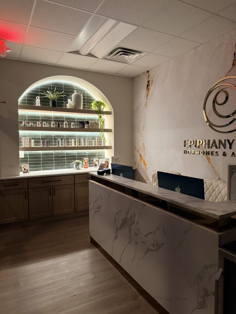 The front desk and retail wall at Epiphany Clinic in American Fork, Utah